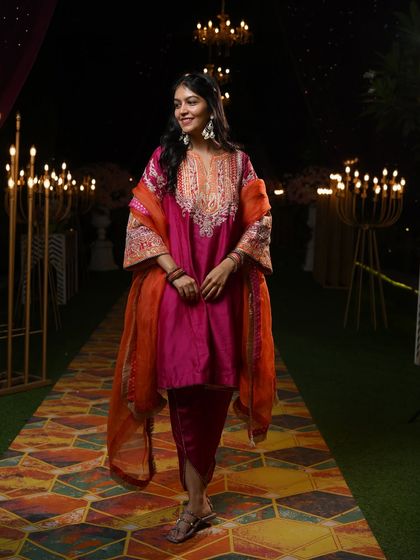 Walking down a beautifully lit path in my Mehendi outfit. The right outfit makes you feel confident and ready to enjoy every moment of the celebration.