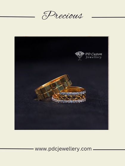 A precious set of matching bands for a couple. One is a solid 22kt gold band with a modern block pattern, and the other is an 18kt gold band with an intricate, sparkling diamond braid design.