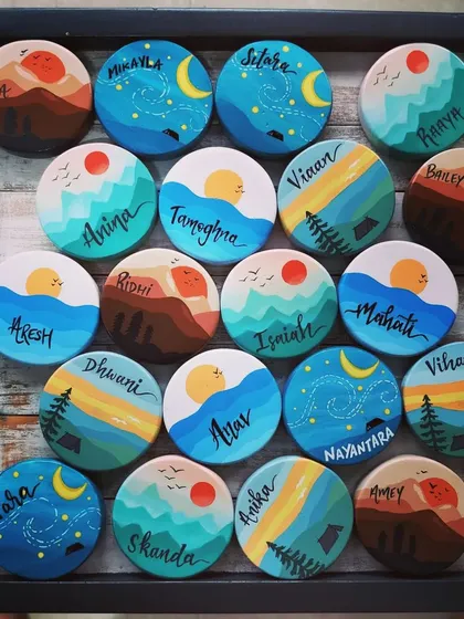 We create joy in all sizes. This collection of personalized, travel-themed wooden magnets was made as unique return gifts for a birthday, with each tiny landscape telling a different story of adventure.