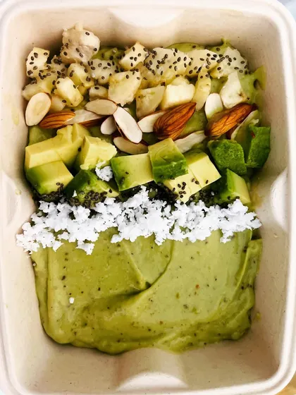 This is my power-packed avocado smoothie bowl. It’s a creamy, nutrient-dense meal made with fresh avocado and banana, then topped with almonds, dragon fruit, and chia seeds for extra texture and nutrition.