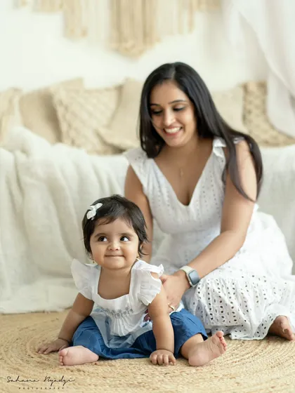 A mother and daughter moment in our bright, boho studio. The natural light and soft colors create a beautiful, warm atmosphere.