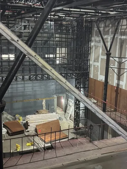 A view from the upper level during the Parker Hall construction, showing the intricate new steel framework being inserted into the historic shell.