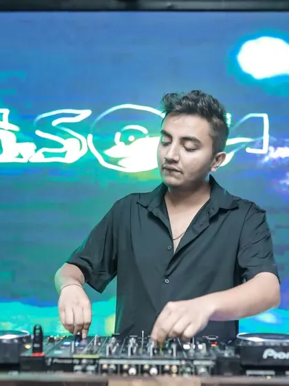 Another shot of me focused on my craft, with my custom visuals in the background.
