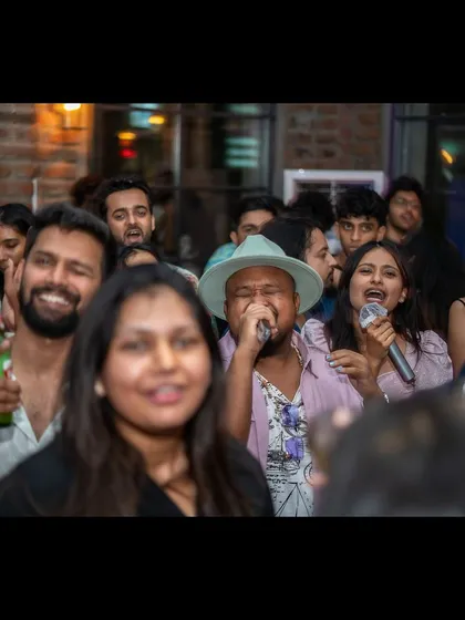 Here you see a guest who's a regular performer, completely owning the stage. My nights attract people who truly love to sing and perform for a live audience.