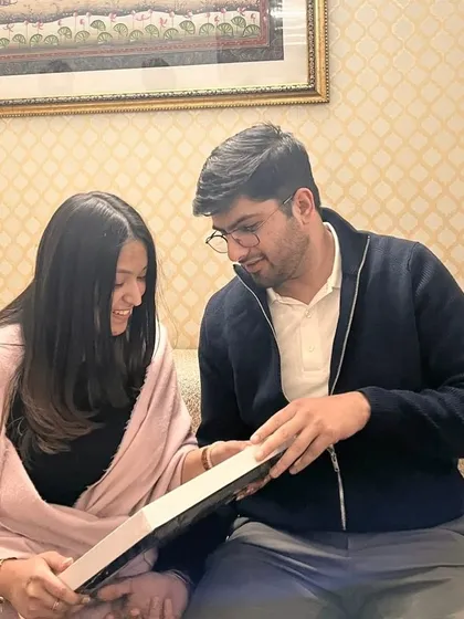 The best moment: watching the couple relive their memories as they unbox their personalized story frame. Their smiles say everything.