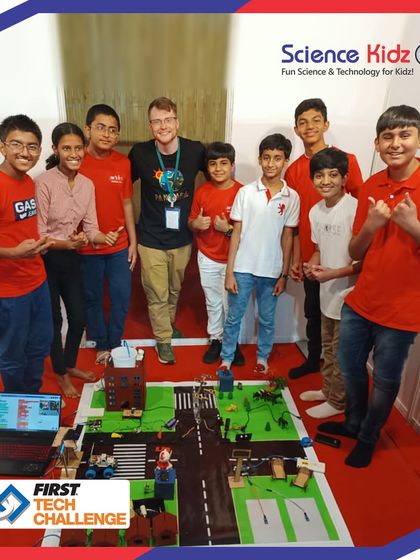 Our students posing with a judge at the FTC India Championship. They confidently presented their project and answered technical questions about their design and code.