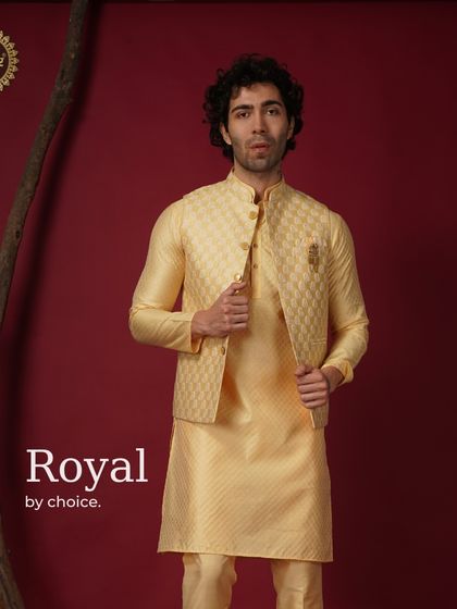Royal by choice. A yellow patterned Nehru jacket and kurta set, exuding brightness and confidence.