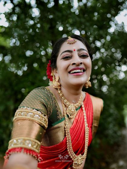 A close-up shot of the bride's ecstatic smile, a moment of pure, uninhibited joy on her wedding day.