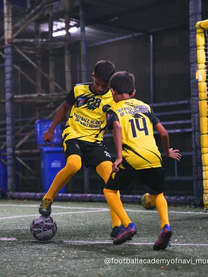 A player uses a sole roll to control the ball and shield it from an incoming challenger.