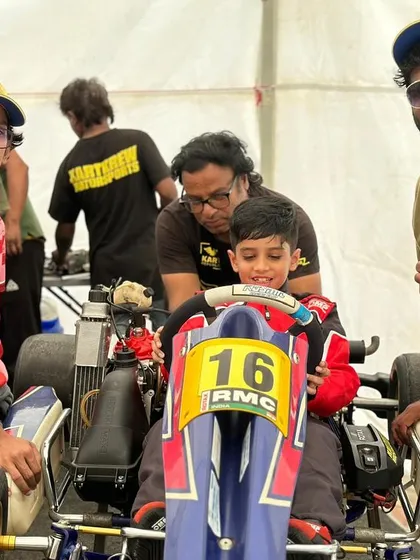 The team gathers around a young driver, showing the supportive environment we create.
