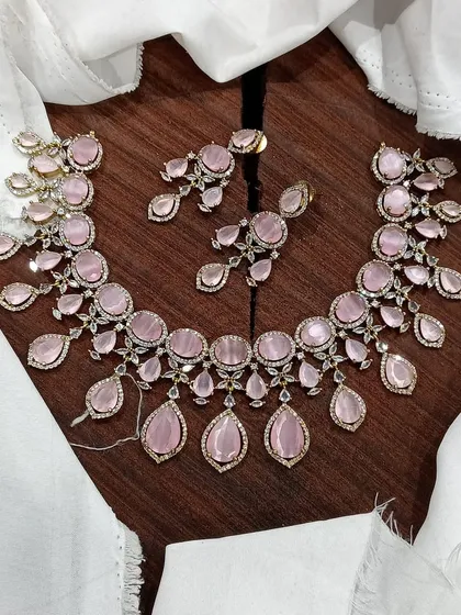 The same AD necklace design with soft pink stones.