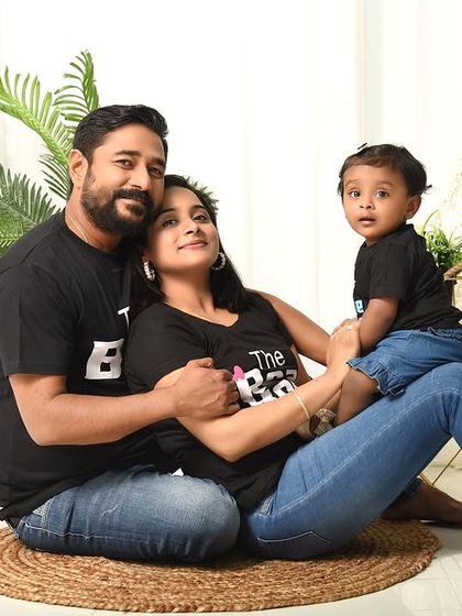 A loving family portrait taken during a first birthday session. The casual, relaxed pose in our boho set captures the family's connection and happiness.