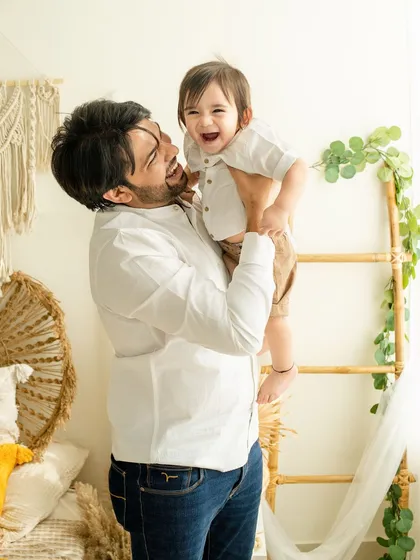 The sound of laughter between a father and his son. I believe the most beautiful portraits are the ones that capture unscripted, heartfelt joy.