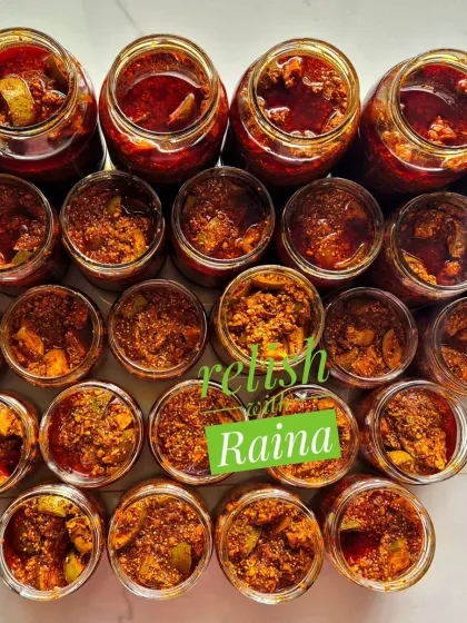 Jars of my Spicy Khatti Kairi Pickle, a summer specialty. I use sour 'Ladua' raw mangoes, which have more pulp, and a traditional blend of Rajasthani spices in mustard oil to create this tangy and fiery achaar.