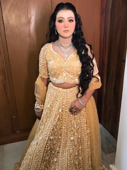 A full-length shot showing the complete styled look, with the diamond set adding a touch of luxury.