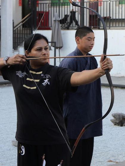 The art of archery requires immense focus, a steady hand, and a calm mind. Here I am practicing traditional archery, a discipline that complements our Kung Fu training.