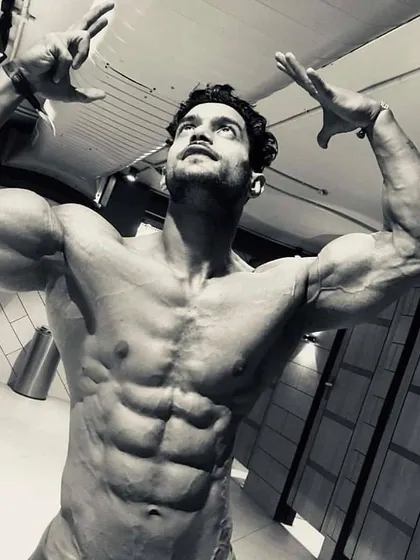 Fitness is an art form, and your body is the masterpiece. This pose captures the muscle definition and symmetry that comes from years of dedicated training. The pain of today is the strength of tomorrow.