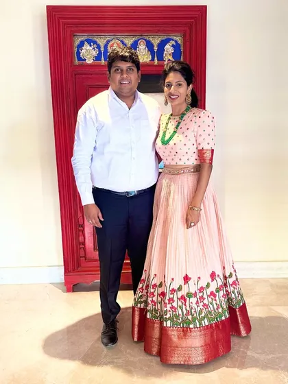 The happy couple, with our client looking stunning in her custom peach anarkali.