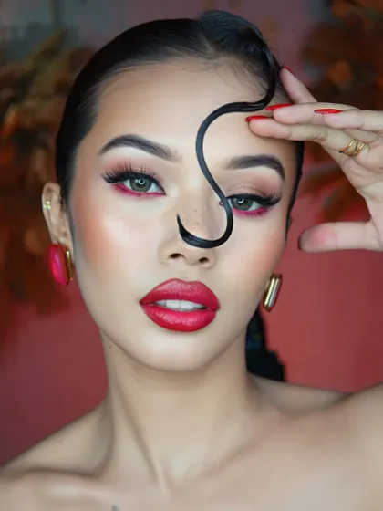 Our course goes beyond bridal looks. We teach you how to create bold, editorial makeup like this showstopper look, featuring a sculpted glow, flutter lashes, and a dramatic crimson waterline.