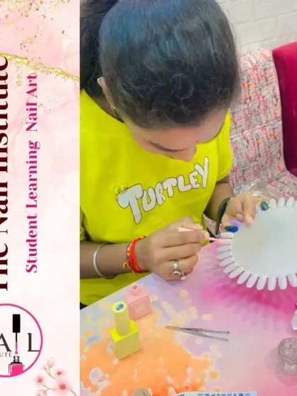 This student is practicing her nail art skills on a color wheel, experimenting with different colors and patterns.