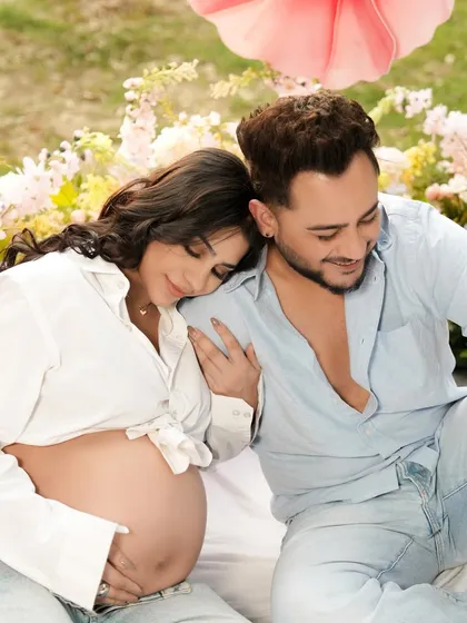 A close-up of Pria and Millind, showing the gentle affection and excitement of their pregnancy journey.