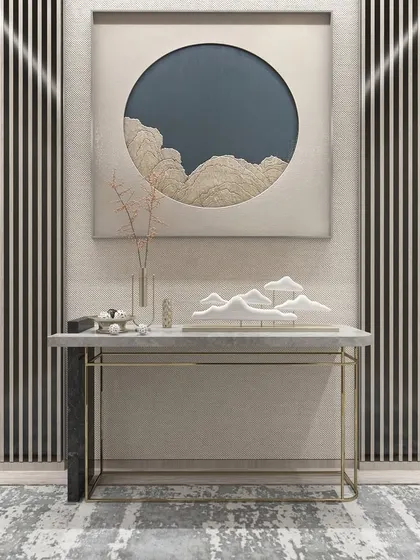 This amazing console table combines a sleek marble top with a minimalist metal frame. It's an ideal addition to any entryway, offering a sophisticated space for displaying decor.