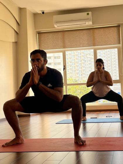Grounded and focused in Goddess Pose. You can feel the strength and stability we cultivate in our standing sequences.