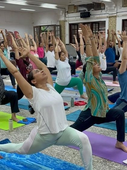 The powerful energy of our tribe practicing Virabhadrasana I (Warrior I) together. This pose builds strength, confidence, and focus.