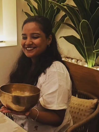 A participant holds a Tibetan singing bowl, used for sound meditation at the end of our "Design Your Life" workshop to help everyone relax and recharge.