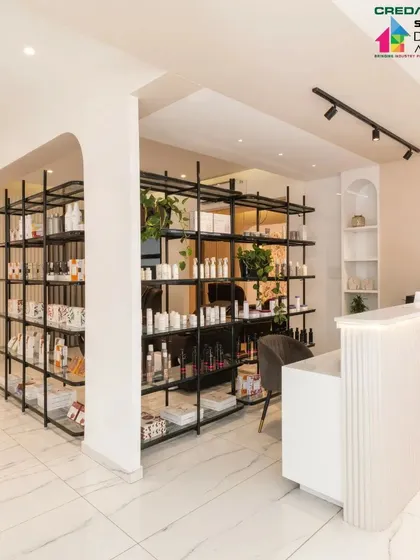 The flow of the space is intuitive, guiding clients from the reception desk to the service and retail areas.