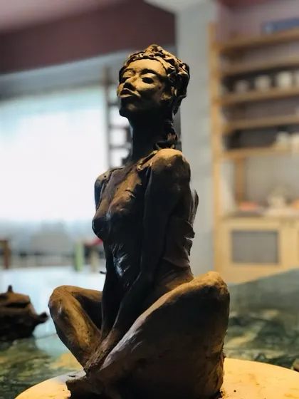I love when my students pour their own stories into the clay. This terracotta sculpture, named "Naughty Girl," is a perfect example of capturing a spirit, a mood, and a bold personality in three-dimensional form.
