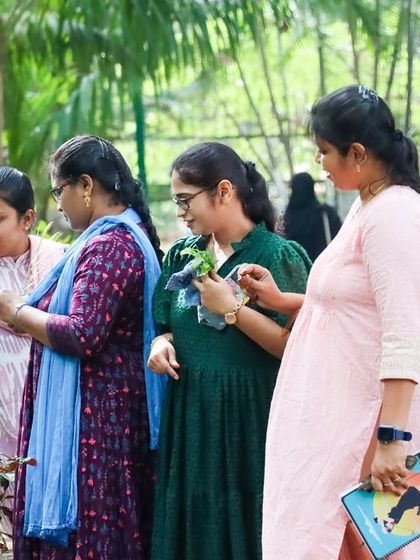Adult learners observing plants during a Nature Walk, a part of our contact classes. We believe in slowing down and connecting with nature, just as we teach children to do.