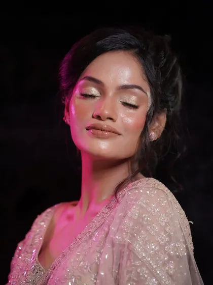 A serene shot with eyes closed, emphasizing the glossy, reflective quality of the skin. This is the hallmark of a true glass skin finish.
