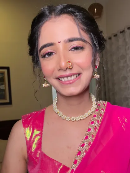 A close-up of Alisha's Haldi makeup. I used soft pink tones on her eyes and cheeks to create a fresh, youthful, and celebratory look.