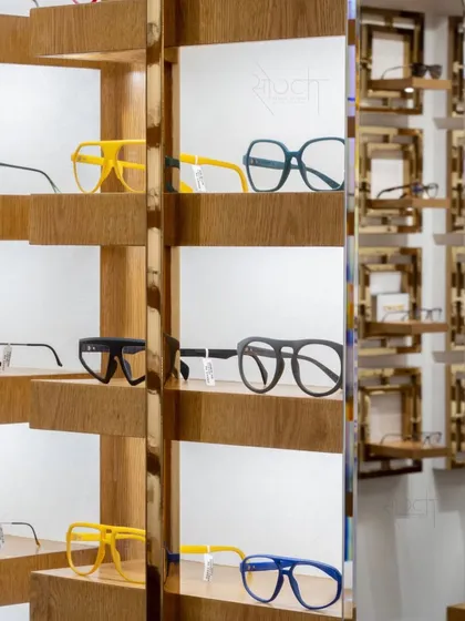 It's all in the details. This close-up shows the custom-designed display shelves, where each pair of glasses is presented like a piece of art.