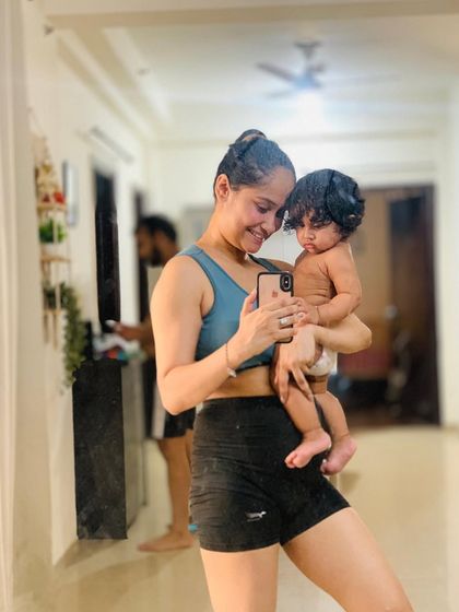A candid moment from our home workout. My daughter is my biggest motivation, and sometimes my smallest workout partner. This is what real life fitness looks like for me.