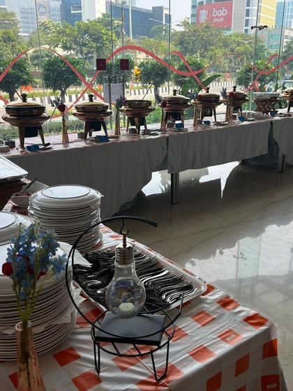 Another view of the Dussehra lunch setup at Kotak, showcasing the long buffet line against the backdrop of their modern office space. I can adapt my setup to any venue.