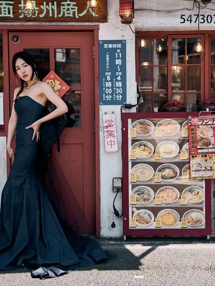 Shooting on the streets of Tokyo. I’m always looking for the lines, the strange shadows, and the contrast between high fashion and the raw energy of a city. We placed a model in a couture gown right in front of a local ramen shop to create a visual story that feels both jarring and beautiful.
