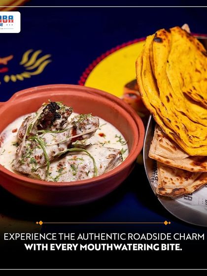 Experience the authentic roadside charm with every bite at Dhaba. This creamy curry served with missi roti captures the true essence of North Indian highway cuisine.