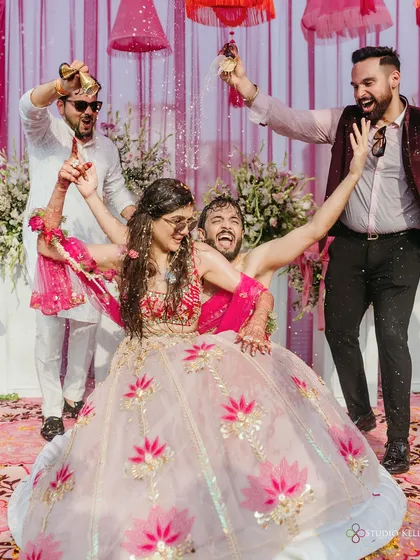The epitome of 'desi masti' as the couple is showered with confetti and fun during their Haldi ceremony.