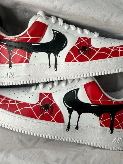 The Spiderman drip custom sneakers displayed in their box.