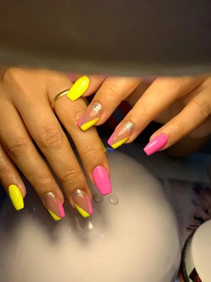 A modern color-blocked design with neon yellow and pink on a nude base.