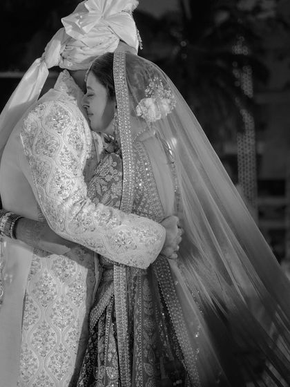 A heartfelt embrace. This photo captures a moment of deep connection and emotion, made more powerful in monochrome.