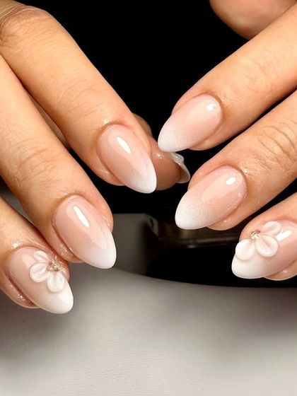 Nail dreams are made of this. A subtle ombré base with delicate 3D floral accents and a touch of sparkle, creating a soft and romantic look perfect for any bride.