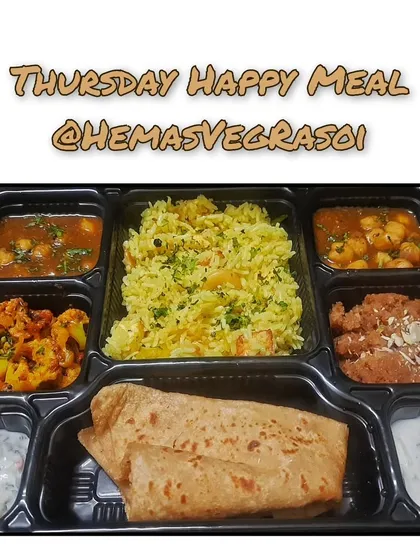 My Thursday Happy Meal is a complete, balanced vegetarian thali that brings the comfort of home to your office. It includes Paneer Pulao, Raita, Chole, Gobi, Parathas, and a sweet Sheera made with pure ghee.