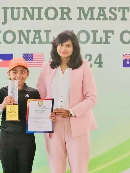 Aahana Shrivastava receives her Championship Title trophy at the Greens to Glory Junior Masters International Golf Championship.