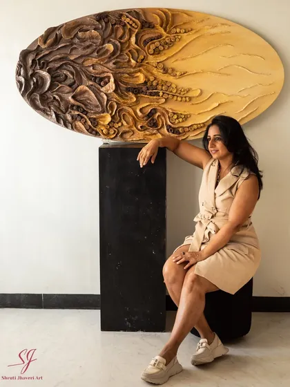 This piece is 'The Enchanted Abyss,' a 60-inch oval sculpture made from upcycled paper and mixed media. It's a piece that shaped me as much as I shaped it.
