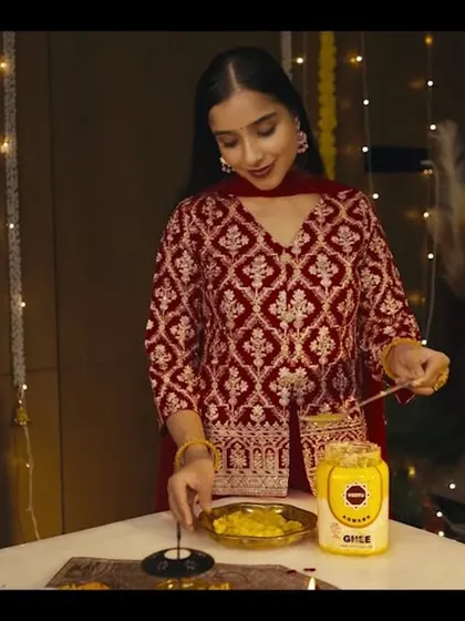 Another still from the Vastu Ghee ad. This shot shows the main actress with a soft, glowing makeup look that appears natural and beautiful on camera.