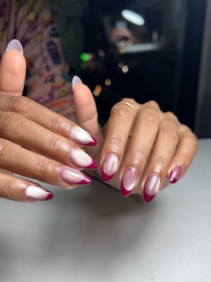 A still shot of the cat eye French manicure, showing off the clean almond shape and the beautiful contrast between the shimmery base and the bold pink tip.