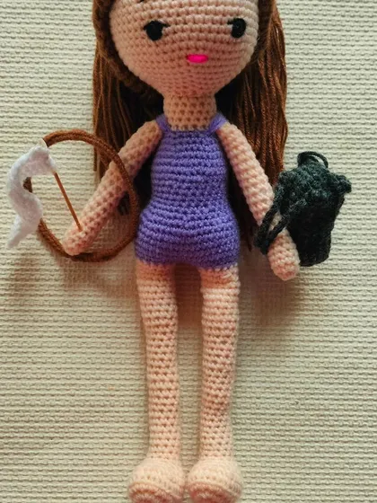 A full-length view of the gymnast doll, showing her long legs and athletic build.